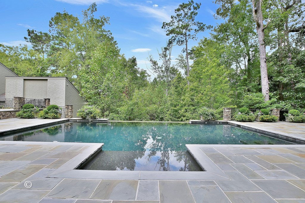 6528 Standing Boy Road Columbus, GA 31904 - Photo 20 of 44 a view of a swimming pool and lounge chair on the terrace