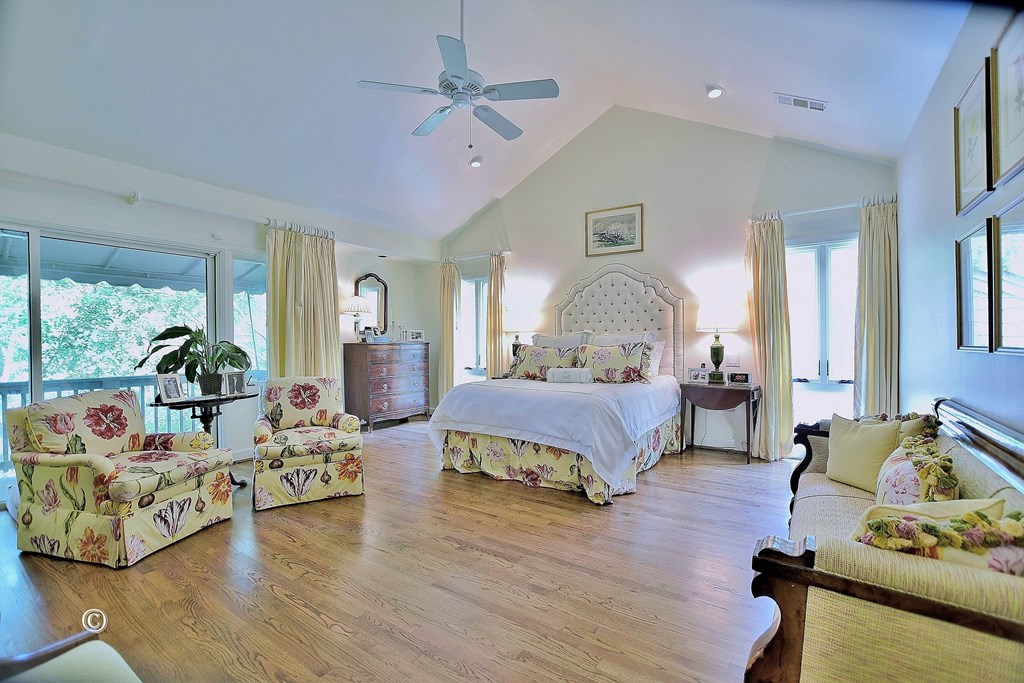 6528 Standing Boy Road Columbus, GA 31904 - Photo 28 of 44 a spacious bedroom with a bed window and couch