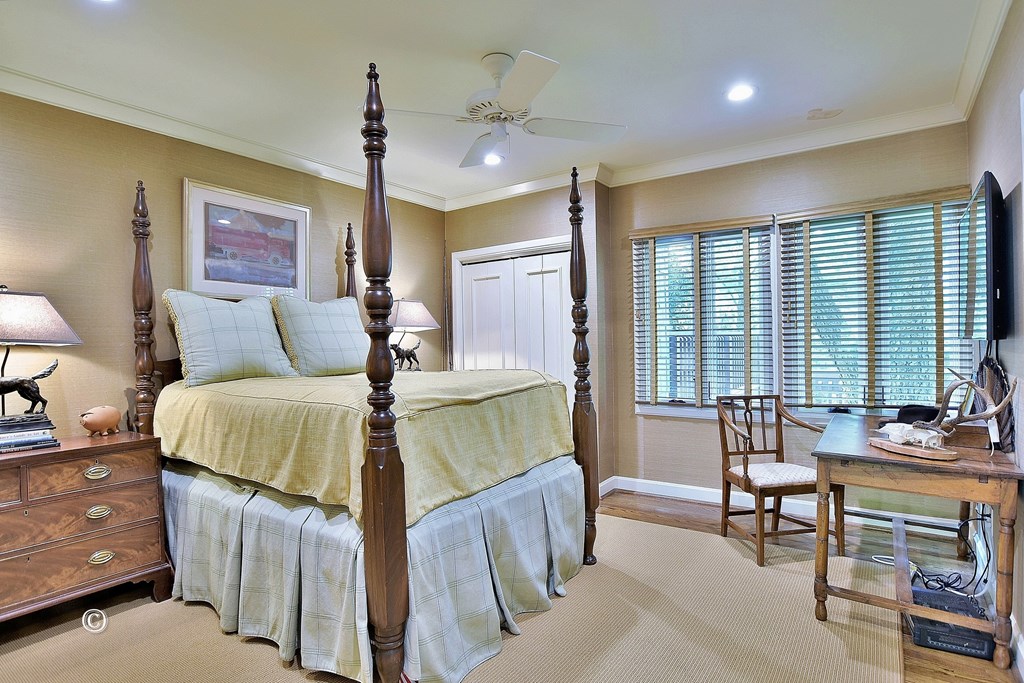 6528 Standing Boy Road Columbus, GA 31904 - Photo 40 of 44 a bedroom with a bed and a chandelier