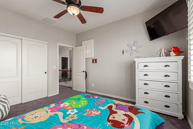 a bedroom with a bed and a tv in it