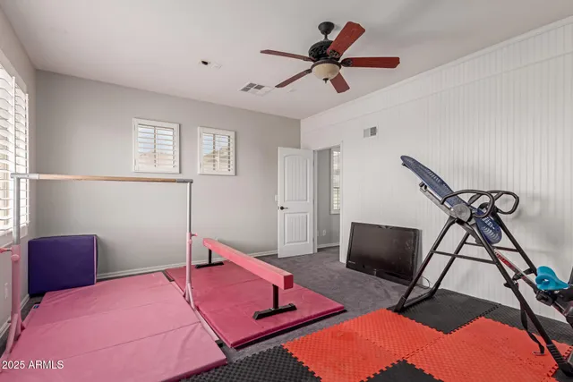 a bedroom with furniture and a window
