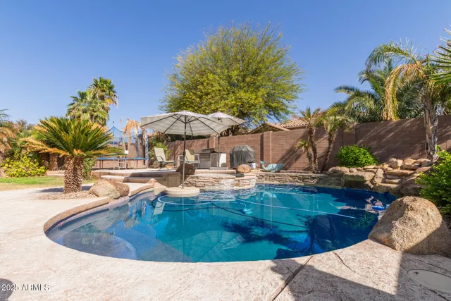 a view of a swimming pool with a patio