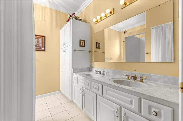 a bathroom with a granite countertop sink a mirror and a shower