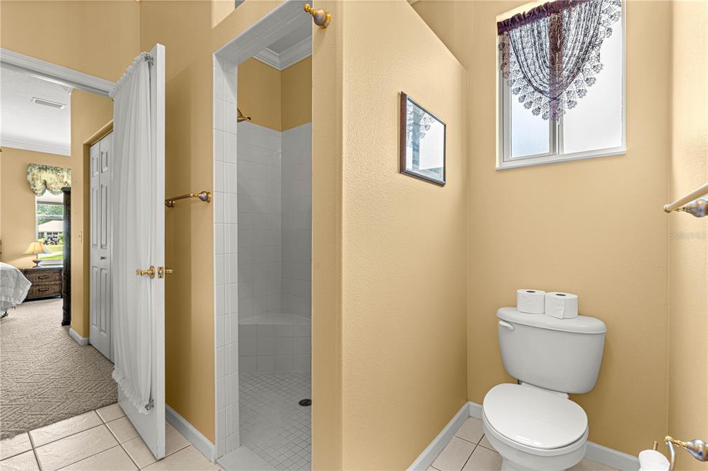 5543 Northwest 25th Loop Ocala, FL 34482 - Photo 21 of 50 a bathroom with a toilet and a shower