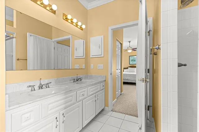 a spacious bathroom with a granite countertop sink a toilet and a mirror