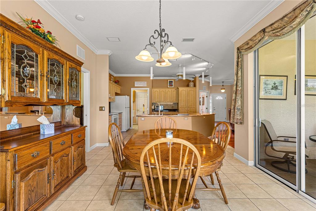 5543 Northwest 25th Loop Ocala, FL 34482 - Photo 24 of 50 a dining room with furniture and window