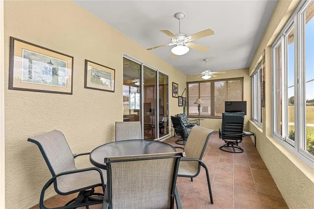 a view of a livingroom with furniture and a window