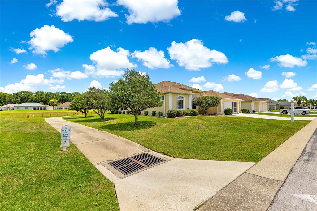 5543 Northwest 25th Loop Ocala, FL 34482 - Photo 36 of 50 a front view of a house with garden