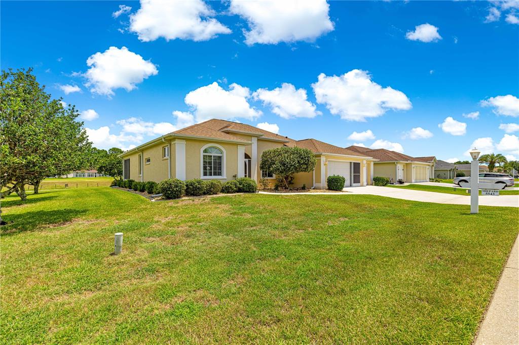 5543 Northwest 25th Loop Ocala, FL 34482 - Photo 37 of 50 a front view of a house with garden