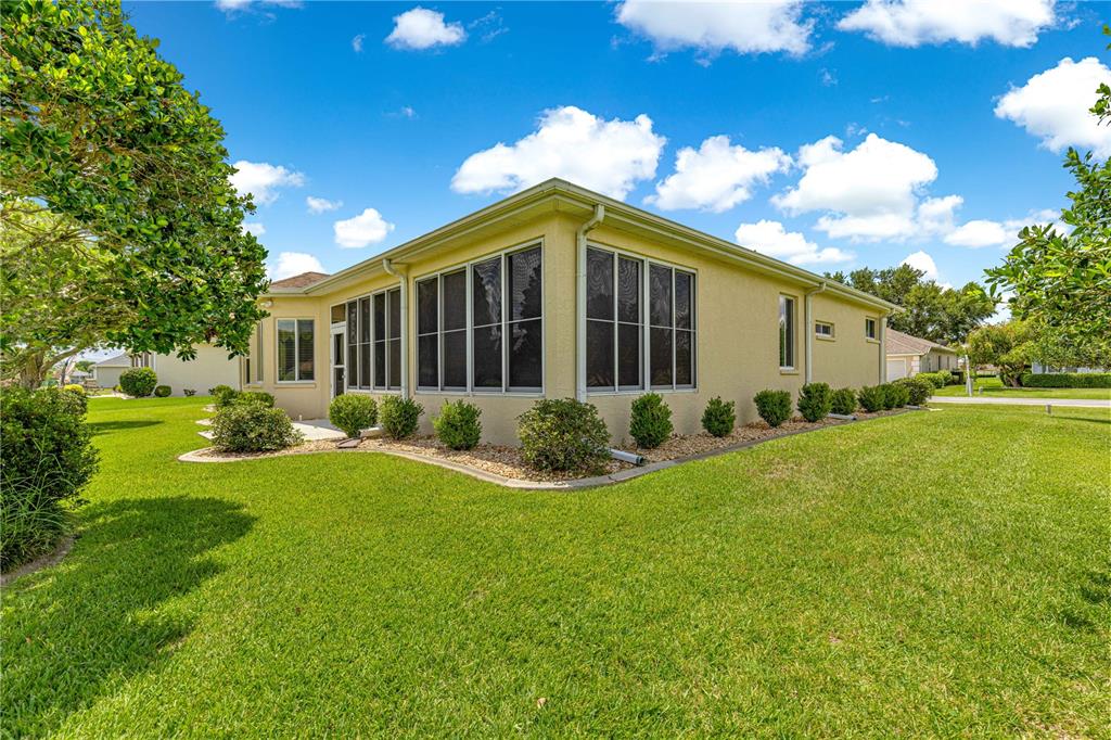 5543 Northwest 25th Loop Ocala, FL 34482 - Photo 40 of 50 a view of a house with backyard and garden