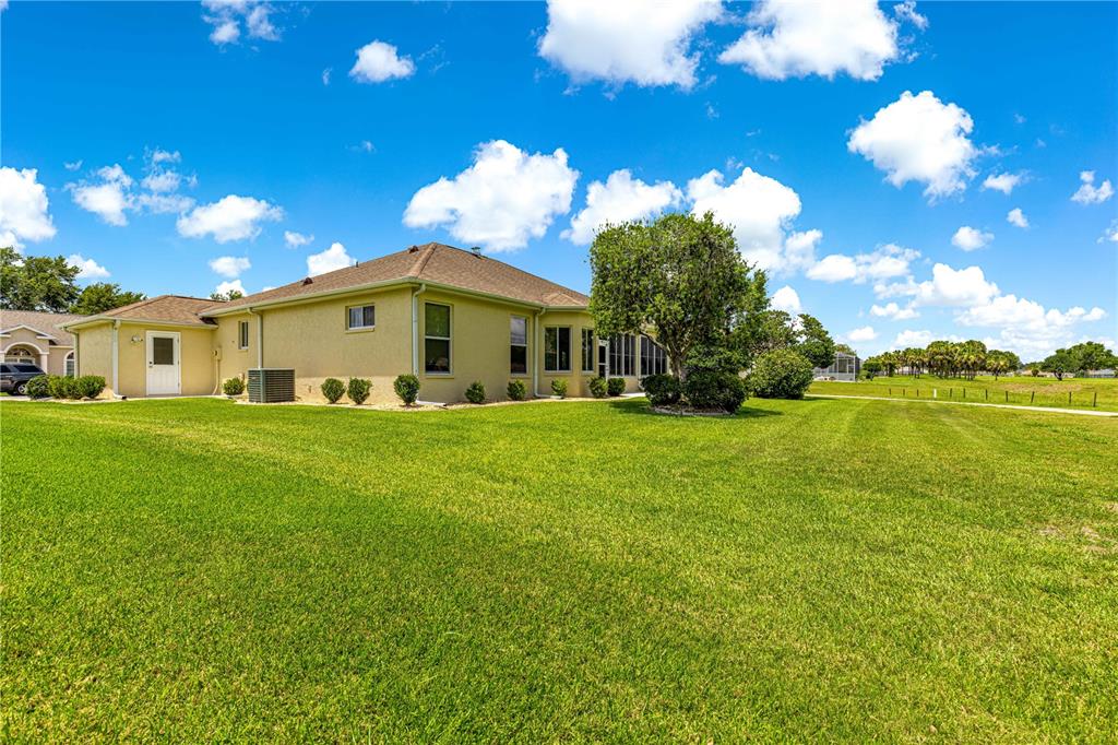 5543 Northwest 25th Loop Ocala, FL 34482 - Photo 45 of 50 a view of a house with a yard