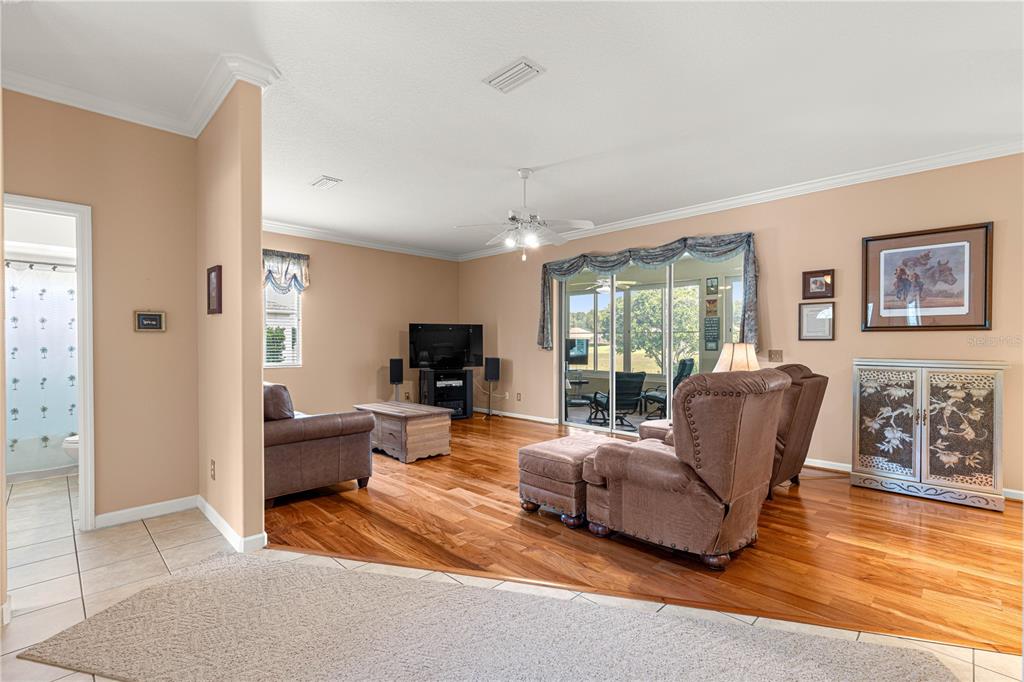 5543 Northwest 25th Loop Ocala, FL 34482 - Photo 7 of 50 a living room with furniture fireplace and a flat screen tv