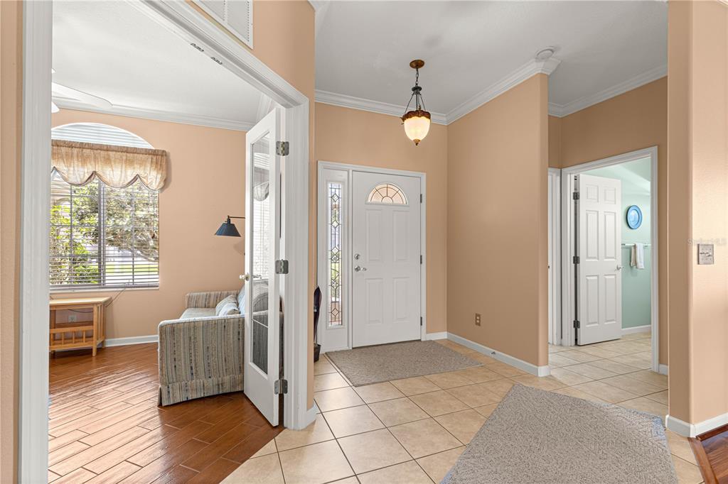 5543 Northwest 25th Loop Ocala, FL 34482 - Photo 9 of 50 a living room with a couch and a table