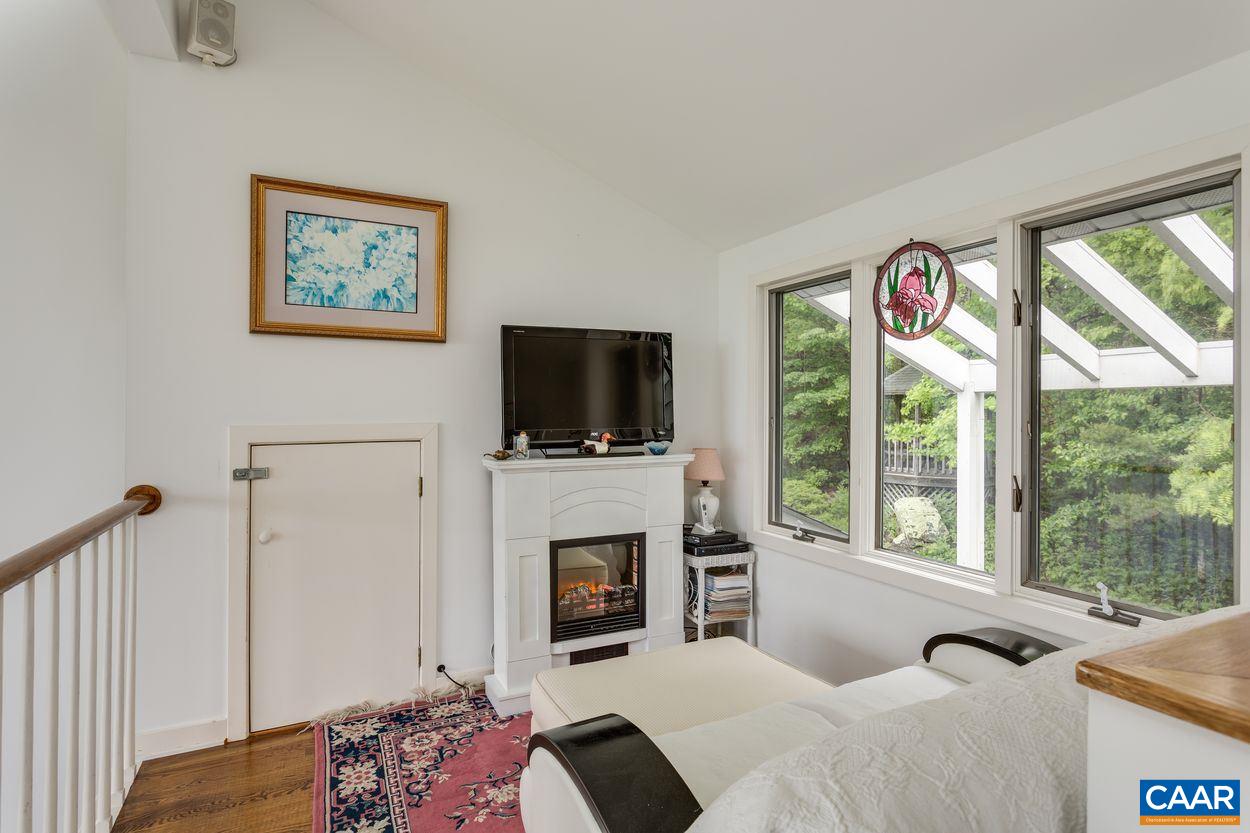 148 Old Stony Ridge Road Afton, VA 22920 - Photo 22 of 32 a bedroom with a bed and a flat screen tv