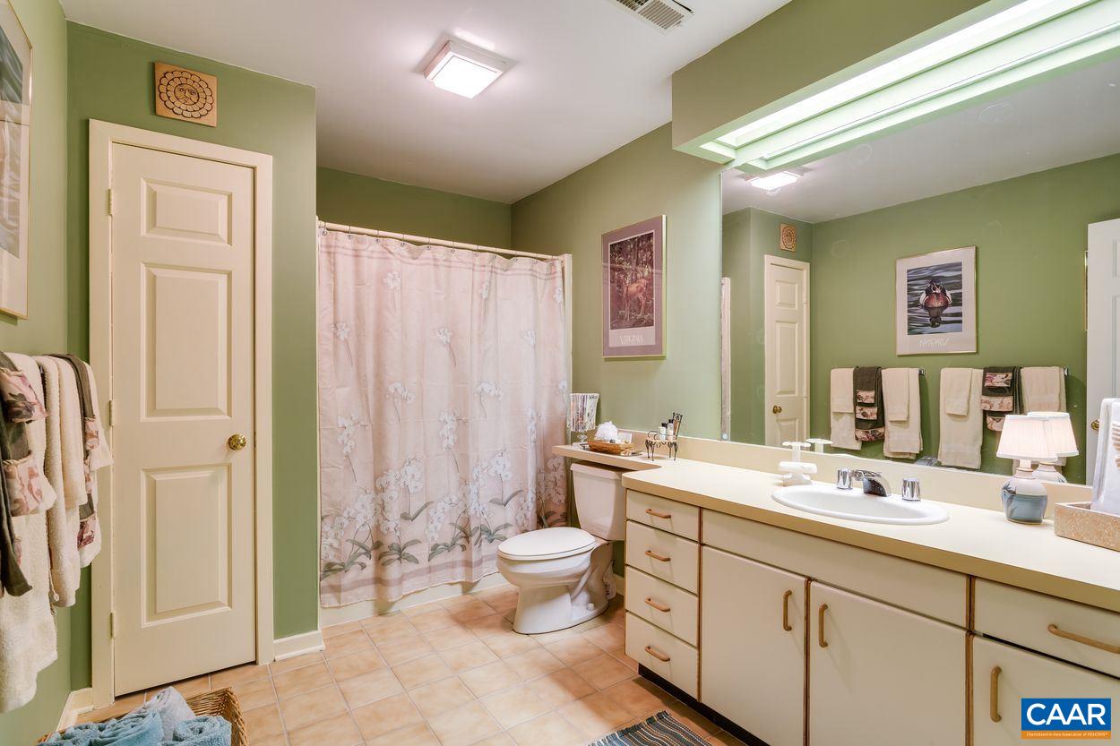 148 Old Stony Ridge Road Afton, VA 22920 - Photo 29 of 32 a spacious bathroom with a double vanity sink mirror and toilet