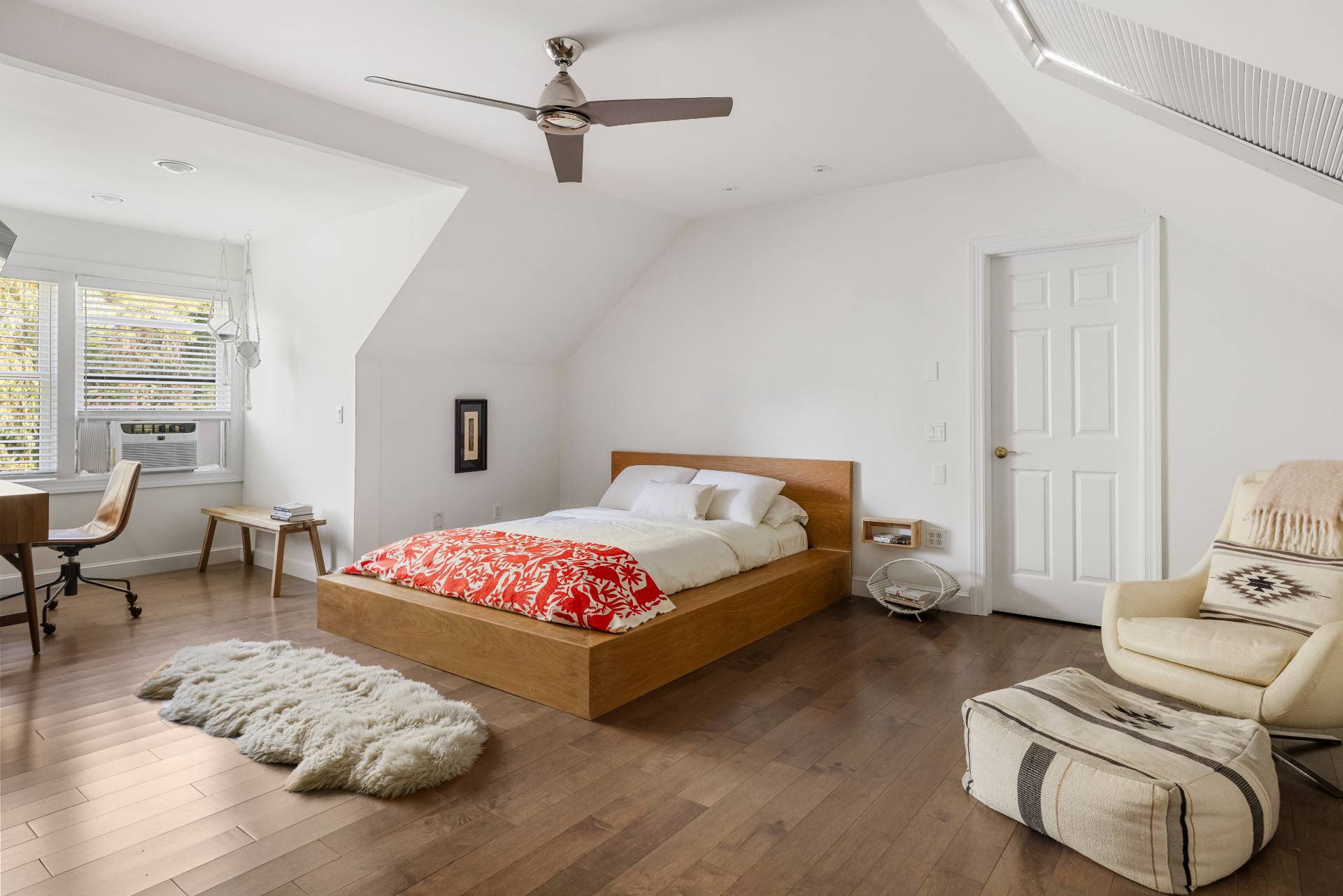 312 Noyack Road Southampton, NY 11968 - Photo 15 of 18 a bedroom with a bed and wooden floor