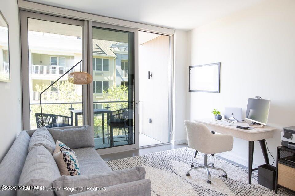 30 Melrose Terrace, Unit 201 Long Branch, NJ 07740 - Photo 11 of 33 a living room with furniture and a window