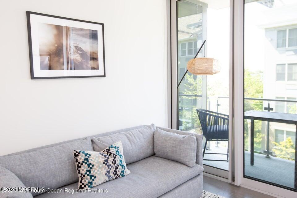30 Melrose Terrace, Unit 201 Long Branch, NJ 07740 - Photo 12 of 33 a living room with furniture and a window