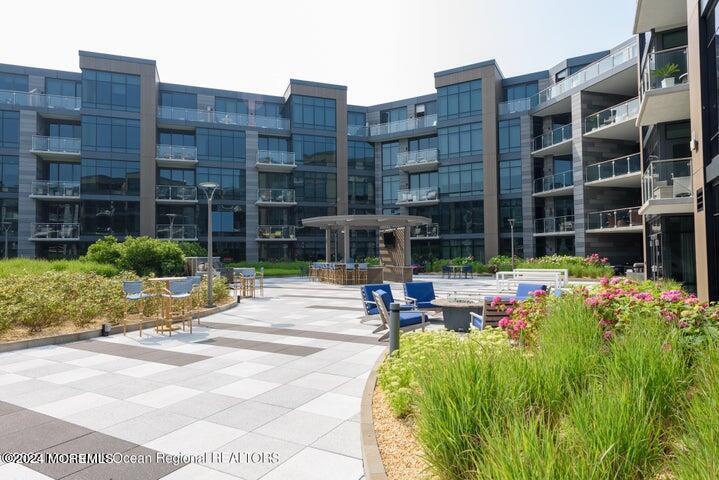 30 Melrose Terrace, Unit 201 Long Branch, NJ 07740 - Photo 20 of 33 a view of pool with outdoor seating