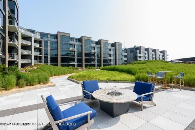 a front view of a building with outdoor seating