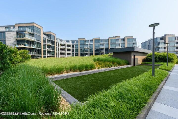 30 Melrose Terrace, Unit 201 Long Branch, NJ 07740 - Photo 25 of 33 a view of a big room with a big yard and plants