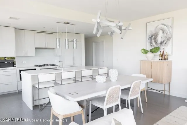 a view of kitchen with table and chairs