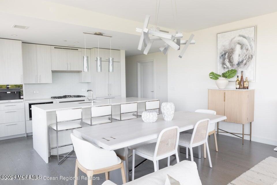 30 Melrose Terrace, Unit 201 Long Branch, NJ 07740 - Photo 3 of 33 a view of kitchen with table and chairs