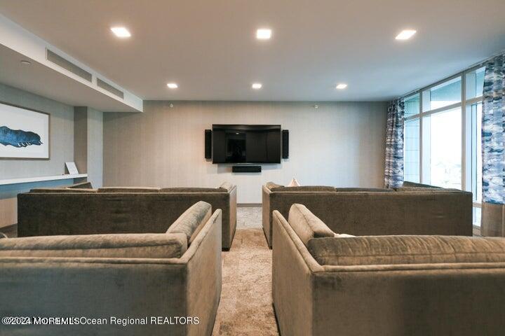 30 Melrose Terrace, Unit 201 Long Branch, NJ 07740 - Photo 32 of 33 a living room with a flat screen tv and a couch