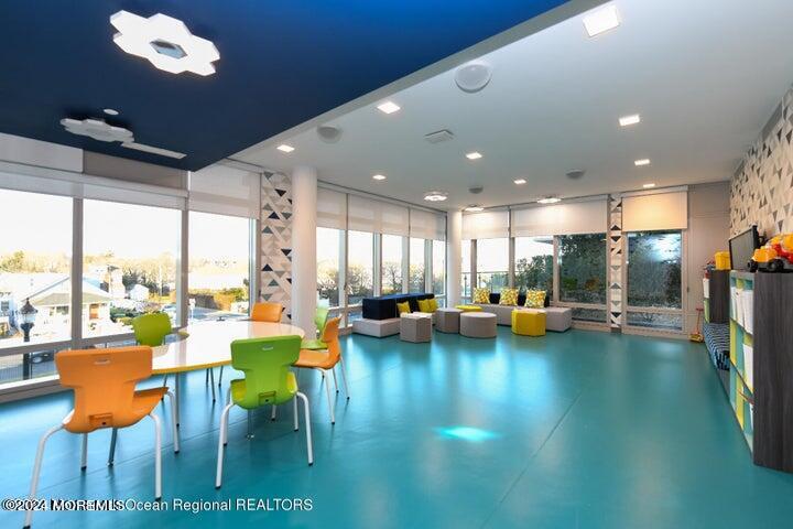 30 Melrose Terrace, Unit 201 Long Branch, NJ 07740 - Photo 33 of 33 a view of a dining room with furniture and a floor to ceiling window