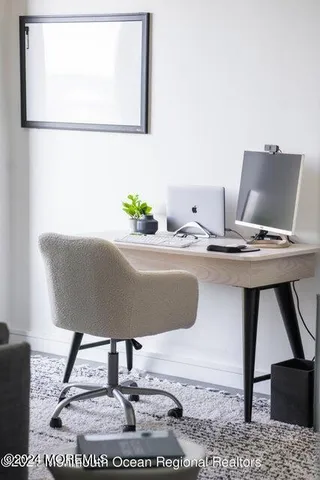 a workspace with furniture and window
