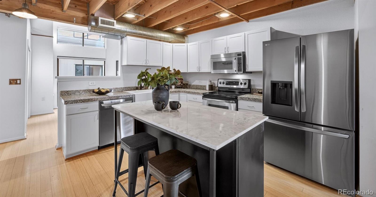 3225 Blake Street, Unit 20 Denver, CO 80205 - Photo 10 of 47 a kitchen with a refrigerator and a sink