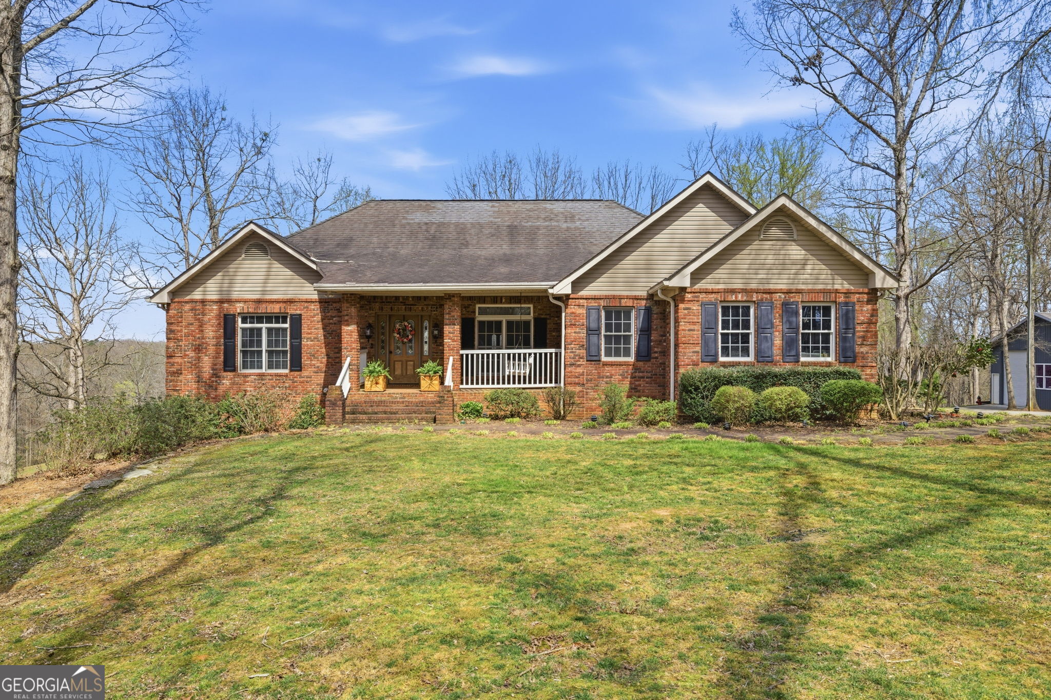 401 Herrin Road Cornelia, GA 30531 - Photo 2 of 83 a front view of a house with a garden