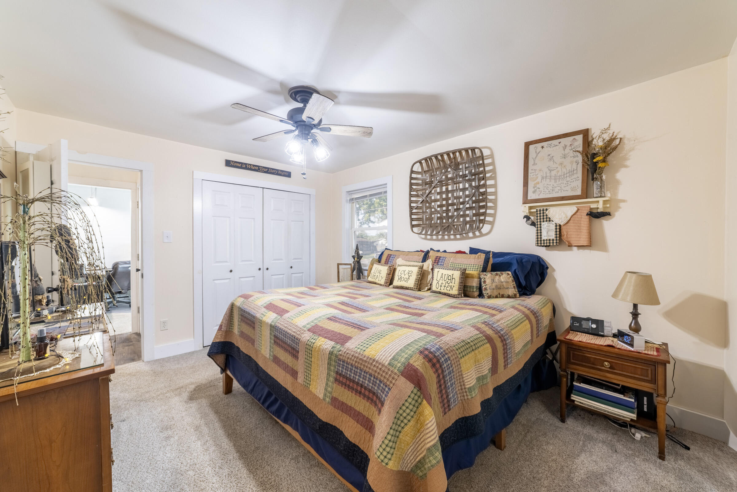 655 Fairview Street Westville, IN 46391 - Photo 11 of 25 a bedroom with a bed and a chandelier