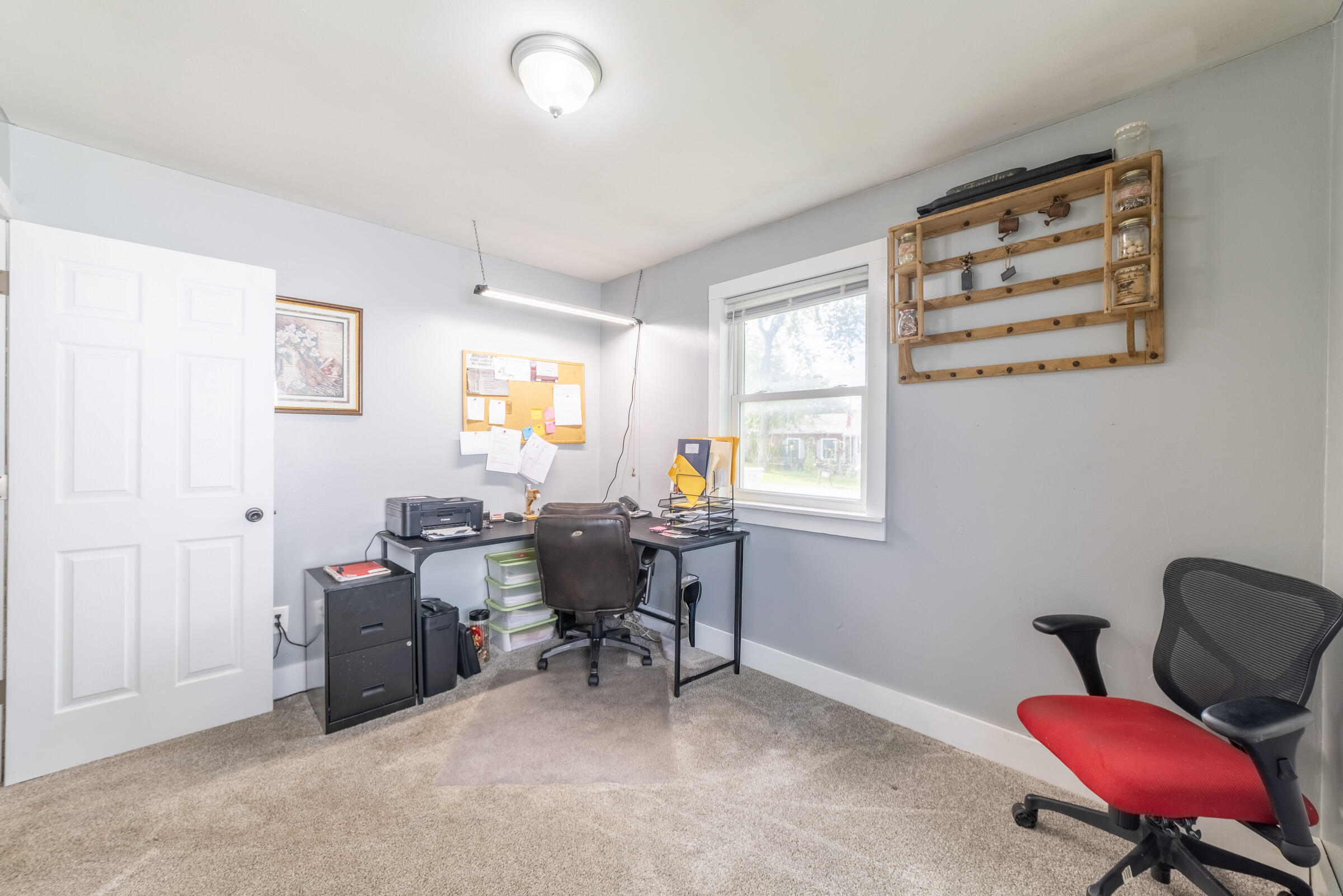 655 Fairview Street Westville, IN 46391 - Photo 17 of 25 a view of a workspace with furniture and a window