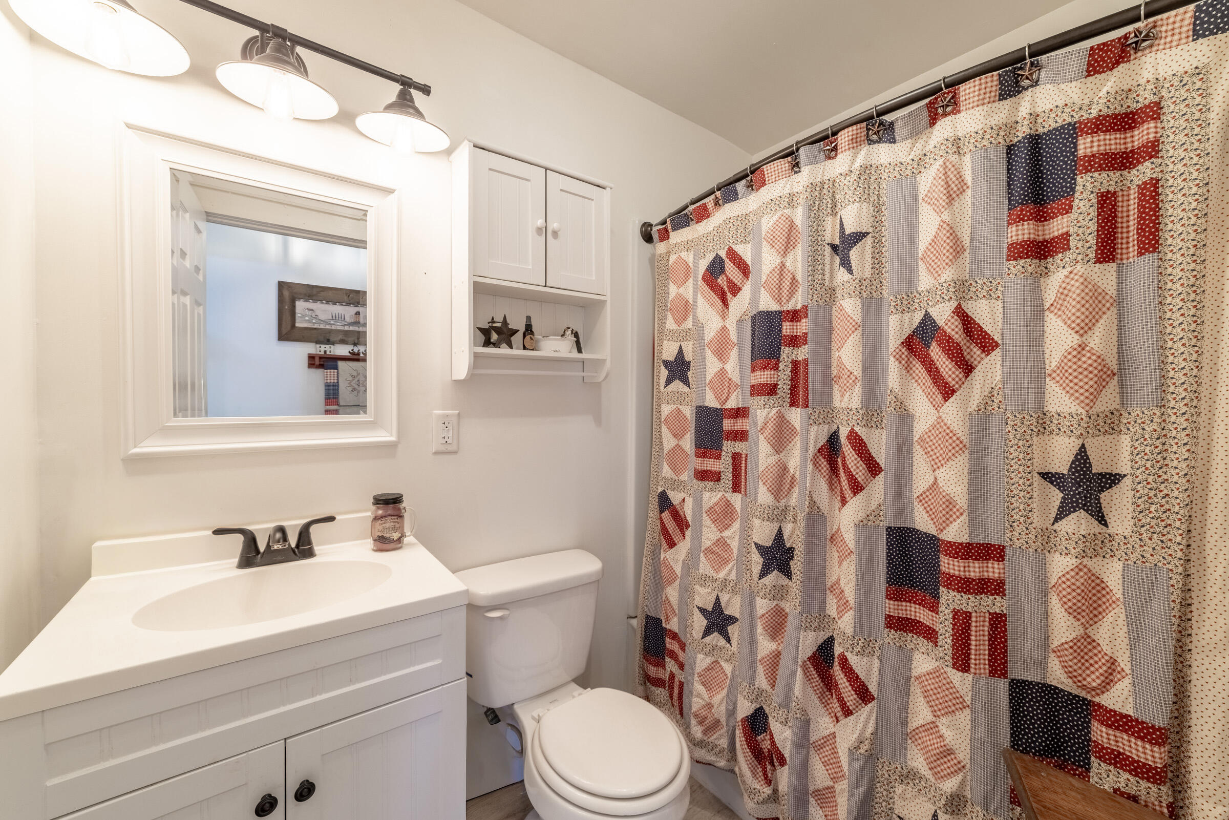 655 Fairview Street Westville, IN 46391 - Photo 18 of 25 a bathroom with a sink and a mirror