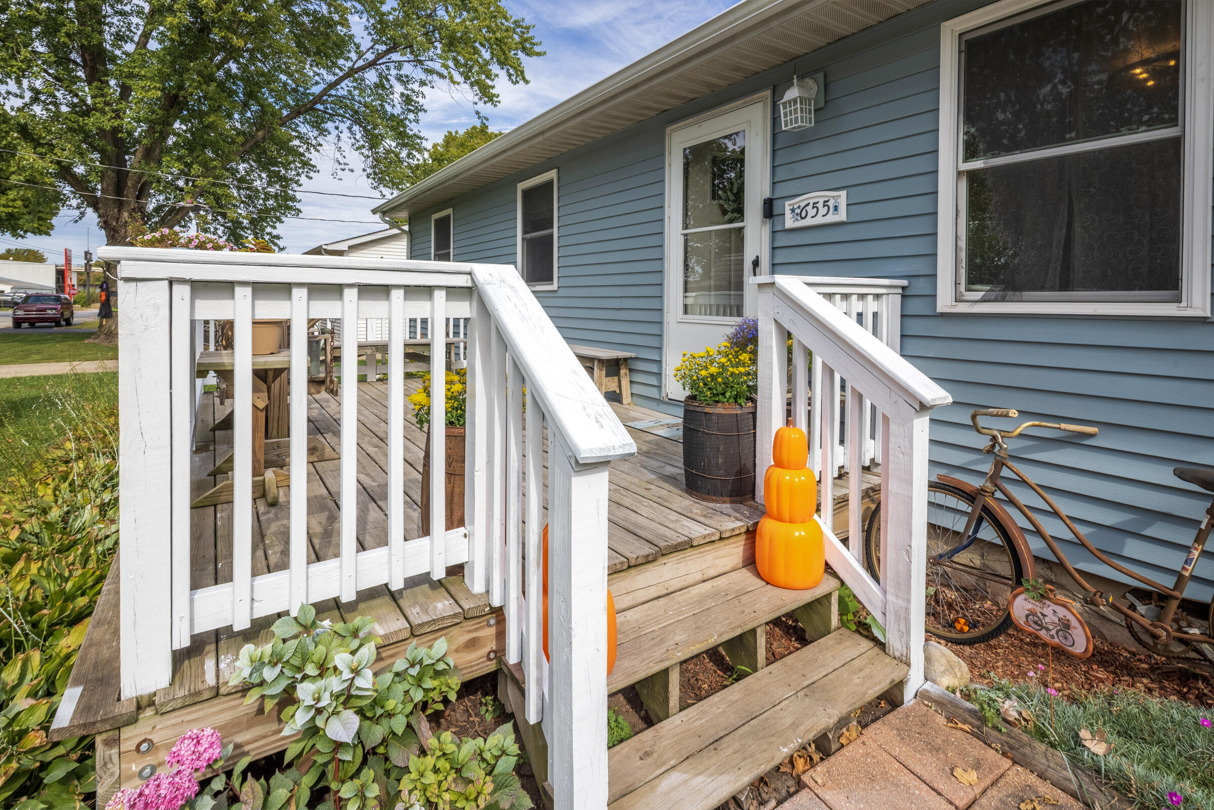 655 Fairview Street Westville, IN 46391 - Photo 3 of 25 a view of small house with wooden floor and fence