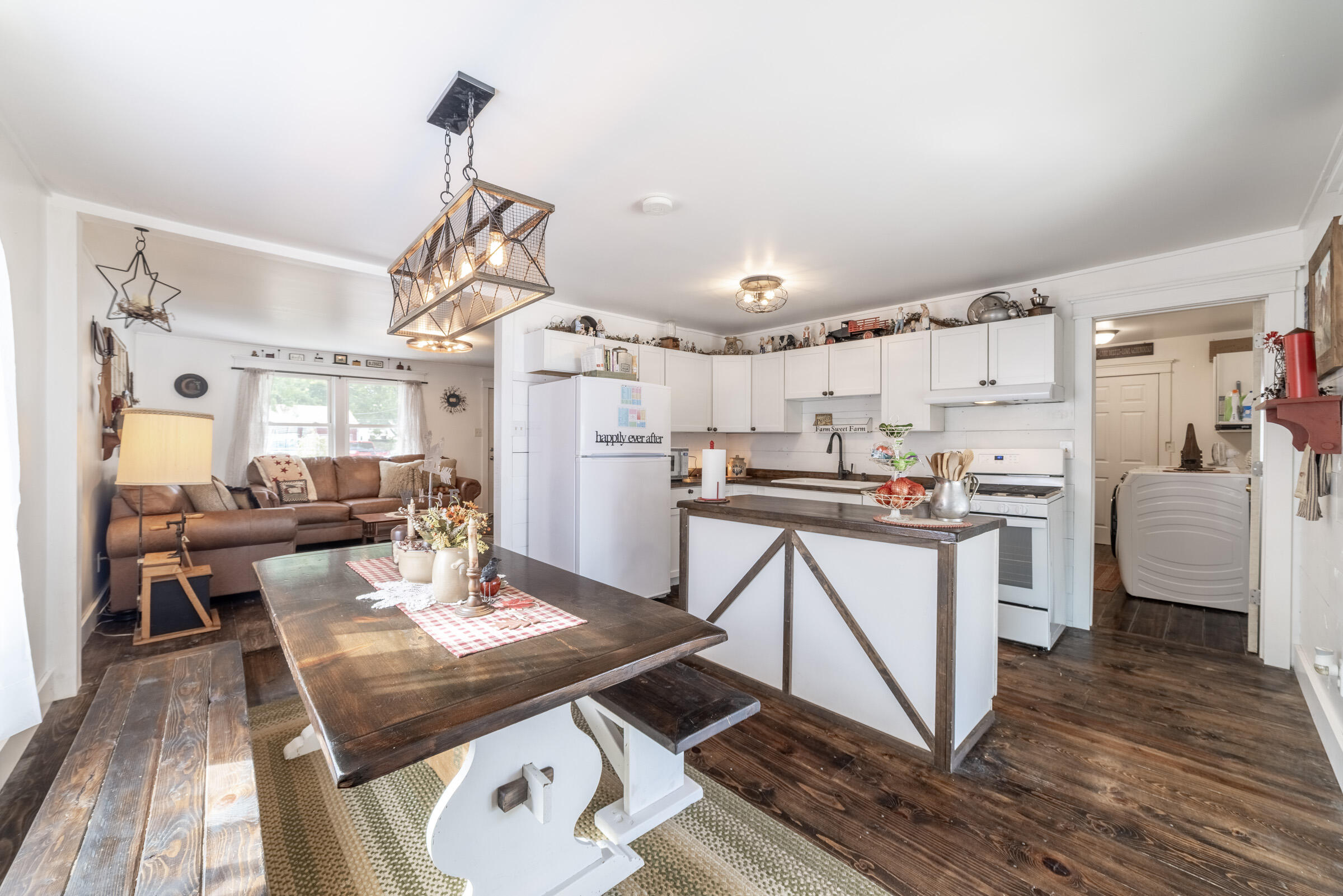 655 Fairview Street Westville, IN 46391 - Photo 7 of 25 a kitchen with stainless steel appliances granite countertop a refrigerator a stove a sink dishwasher and white cabinets with wooden floor