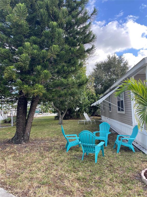 8640 Southwest 16th Court Davie, FL 33324 - Photo 14 of 16 a backyard of a house with table and chairs