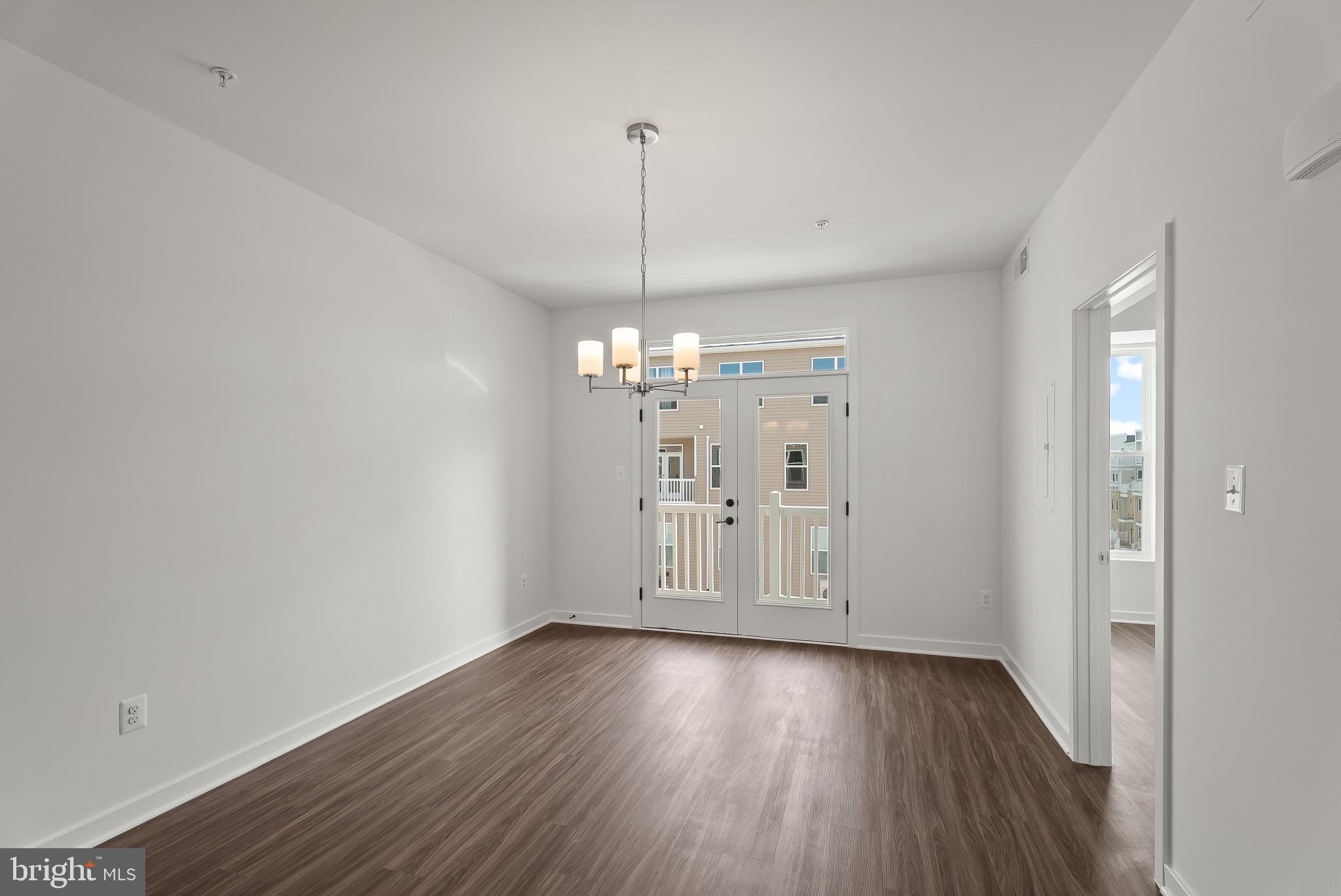 714 D Iron Frg Road Frederick, MD 21702 - Photo 22 of 47 a view of a room with wooden floor and windows