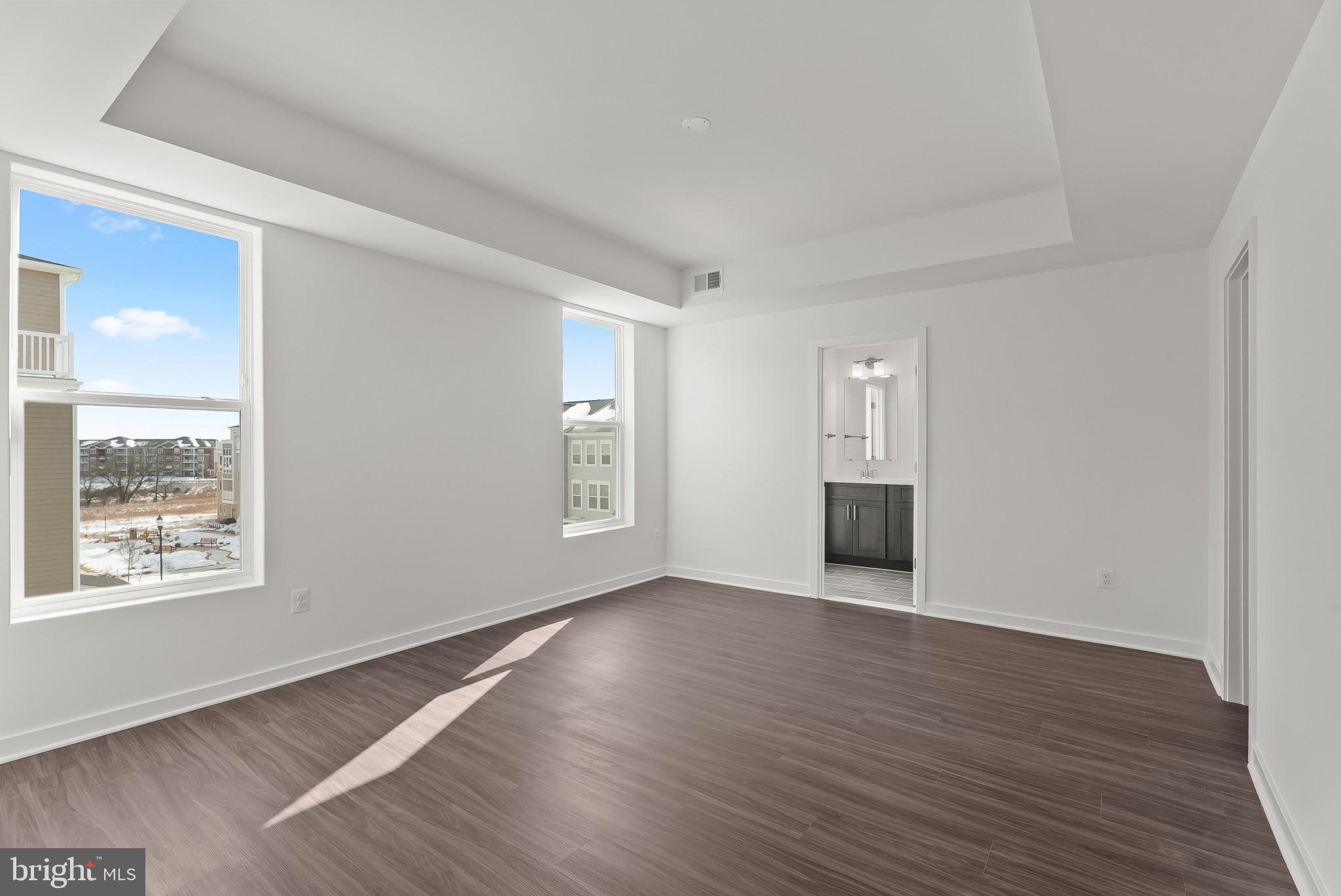 714 D Iron Frg Road Frederick, MD 21702 - Photo 25 of 47 a view of an empty room with wooden floor and a window