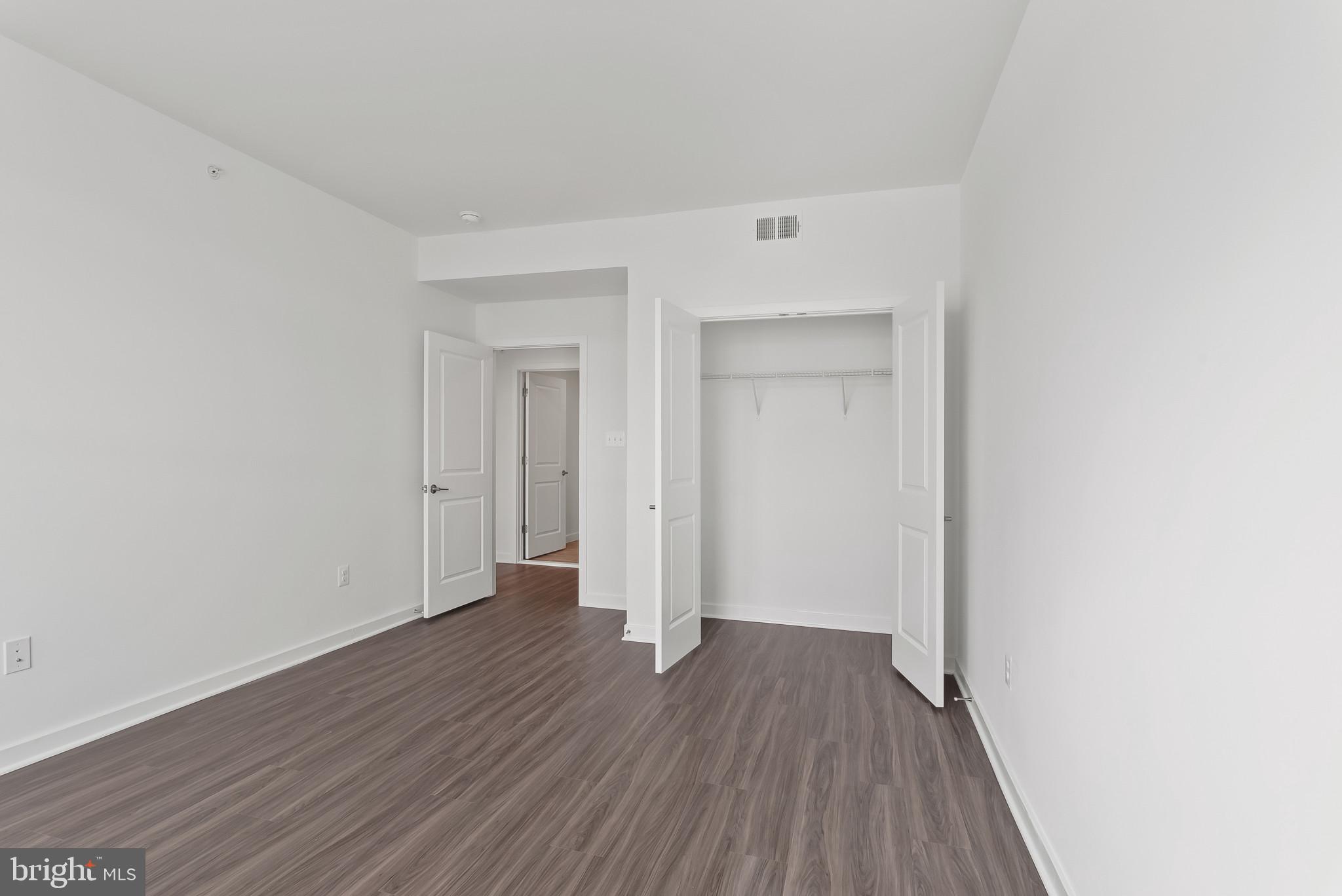 714 D Iron Frg Road Frederick, MD 21702 - Photo 33 of 47 a view of a room with wooden floor