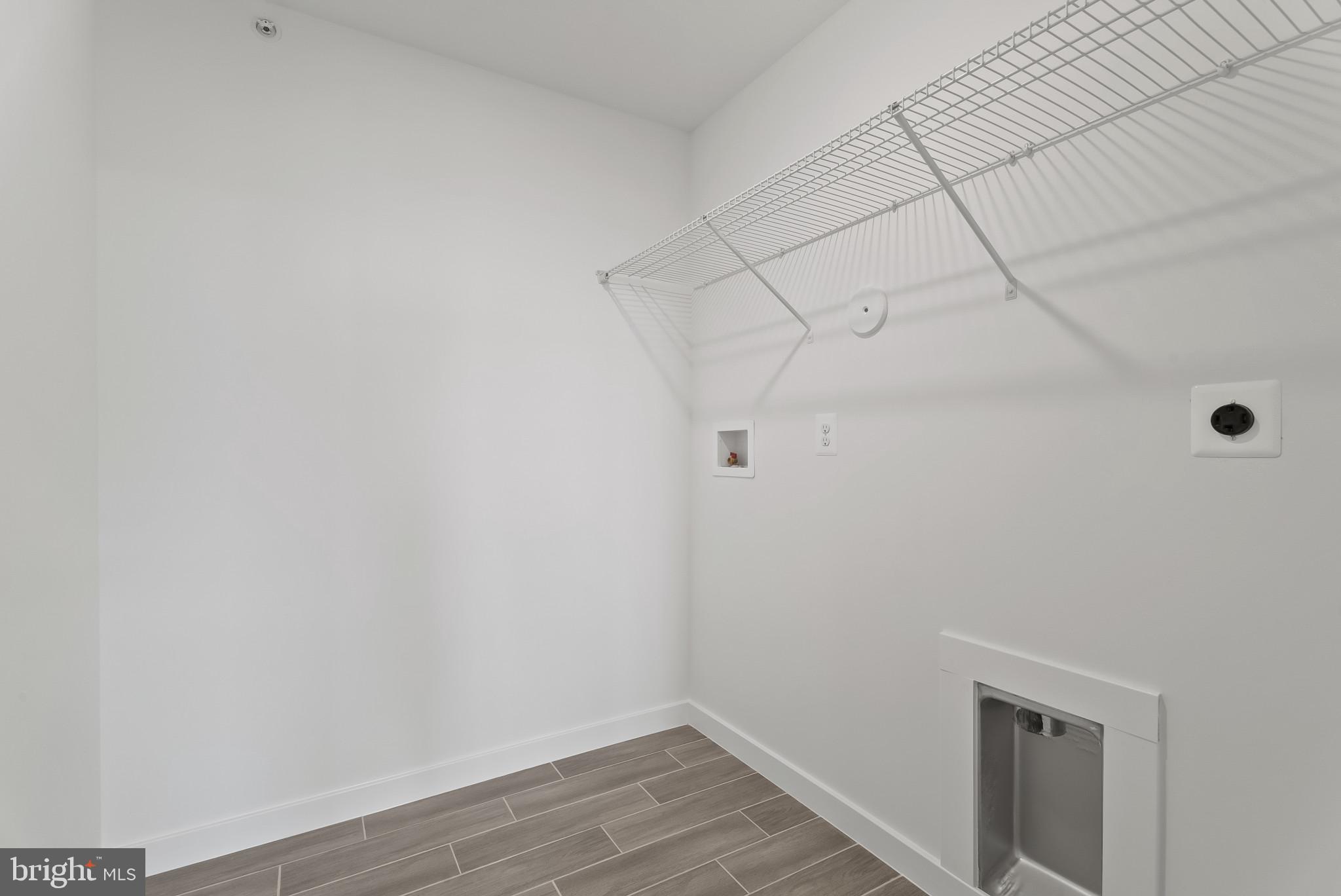 714 D Iron Frg Road Frederick, MD 21702 - Photo 41 of 47 a view of a room with racks on the wall