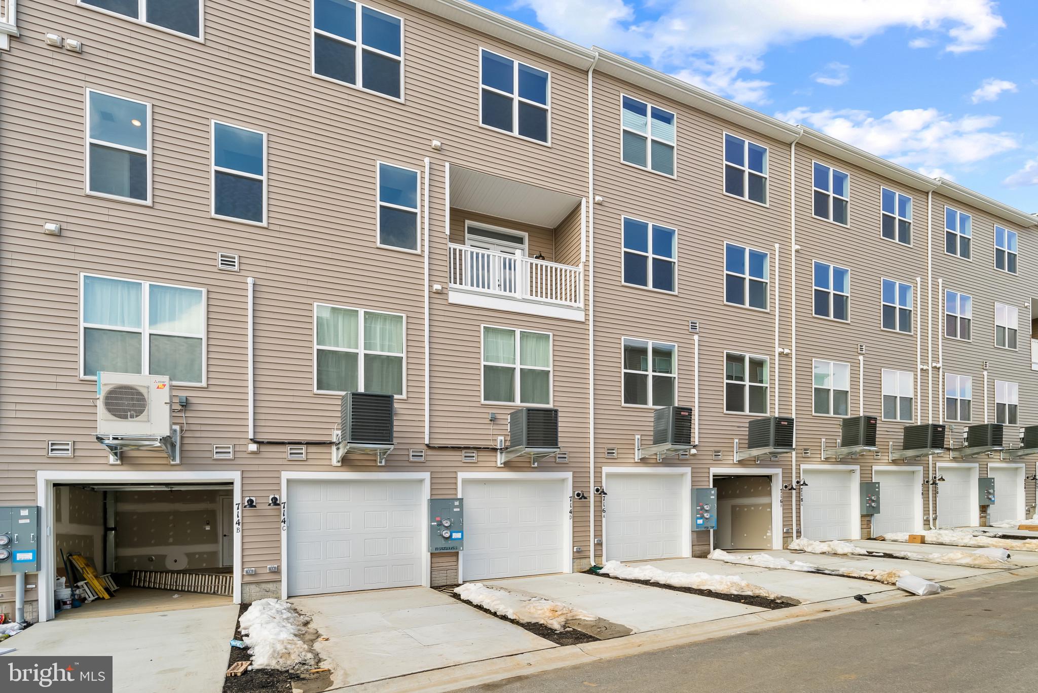 714 D Iron Frg Road Frederick, MD 21702 - Photo 43 of 47 a front view of a building with glass windows