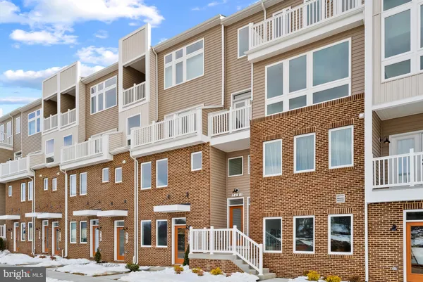 a front view of a building with a lot of windows