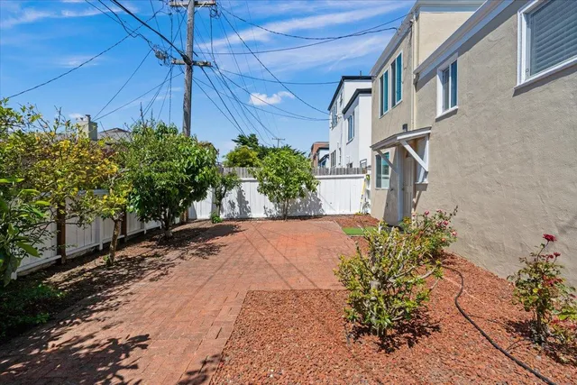 a view of a pathway with a yard