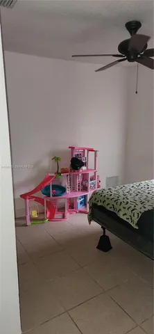 a bedroom with furniture and a chandelier