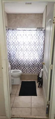 a bathroom with a sink and a shower