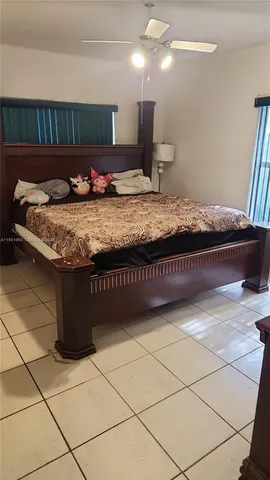 a kitchen with kitchen island granite countertop a sink a counter top and cabinets