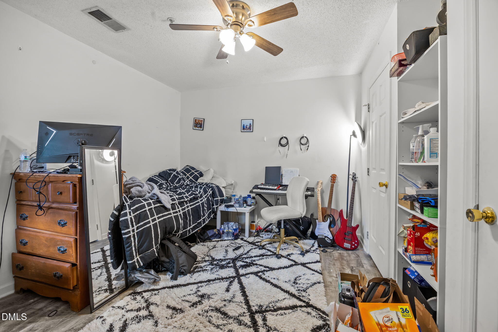 1305 Kent Road, Unit 101 Raleigh, NC 27606 - Photo 19 of 29 a bedroom with furniture and a closet