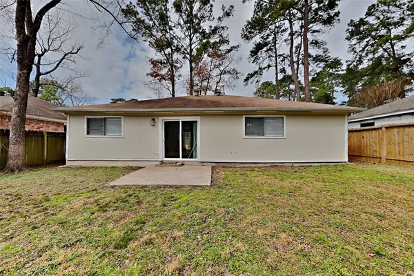 a house with trees in the background
